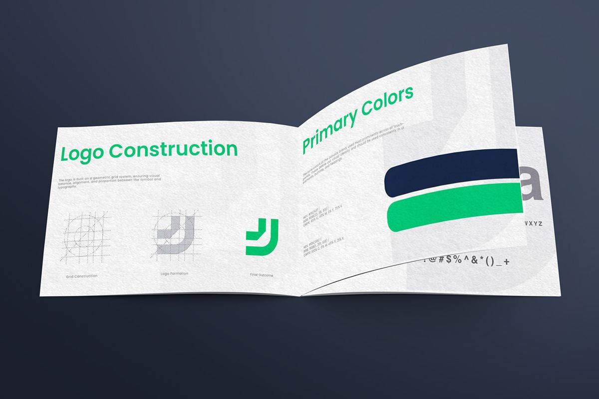 Open Jobulus brand guideline booklet showing logo construction and primary colours